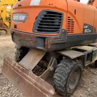 Prix Abordable – Modèle 2022 – Excavatrice sur Pneus d'Occasion Doosan DX60W 6 Tonnes – Matériel de Terrassement d'Occasion – Moteur Yanmar – Godet de 0,23 m³