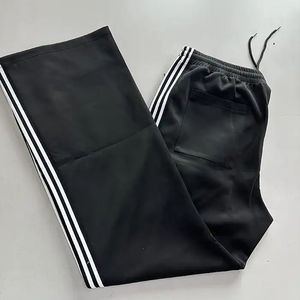 Servicio OEM de alta calidad Pantalones de chándal de pierna ancha de primavera personalizados Pantalones de chándal de punto de secado rápido transpirables de ajuste holgado a rayas - Product Image 3
