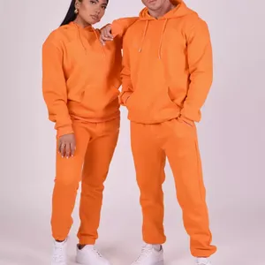 Fabrika toptan yüksek kalite parlak renkli erkek eşofman unisex büyük boy hoodie jogger setleri erkek eşofman turuncu
