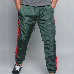 Pantalon de survêtement unisexe en nylon non tissé, coupe droite, à rayures incurvées, coupe régulière, coupe-vent, respirant, écologique, grandes tailles - Product Image 1