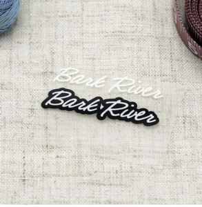 Etiquetas Termoadhesivas Tejidas Ecológicas Personalizadas con Borde Cortado a Láser para Aplicaciones en Prendas (Parte Principal y Cuello) - Product Image 1