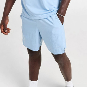 Pantalones cortos OEM de diseño en blanco para gimnasio y fitness al por mayor, pantalones cortos para correr cómodos con cintura elástica y cordón para hombre - Product Image 1