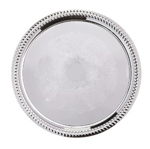 Tazón de acero de diseño asimétrico con curvas metálicas, acabado brillante en plata metálica, ideal para servir. - Product Image 3