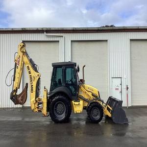 Cargadoras de Ruedas y Retroexcavadoras Diésel New Holland Usadas en Buen Estado con Capacidad de Cucharón de 5.1 m³ y Alta Eficiencia Operativa en Venta - Product Image 1