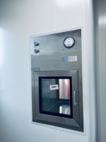 Boîte de transfert dynamique à interverrouillage mécanique pour environnements propres en usine pharmaceutique