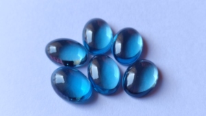 Fine Qualité Naturel Londres Bleu Topaze Ovale 7X9mm Cabochon Lâche Dos Plat Bleu Topaze Facette Gemme En Gros Lot Pour Bijoux - Product Image 2