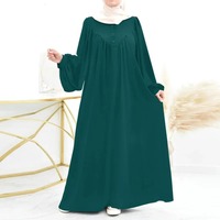 Nouveau musulman printemps et automne mode décontracté bulle à manches longues Simple couleur unie col rond bouton femmes combinaison longue robe