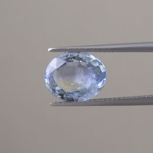 Lab Created Blue Sapphire Loose Gemstone | 12x10mm Oval Cut | 5.38 Carat <b>Polished</b> IGI Certified Genuine Sapphire Phosphorescent - Product Image 1