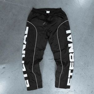 Pantalon de survêtement de survêtement de survêtement personnalisé Pantalon en nylon Streetwear pour hommes - Product Image 4
