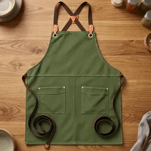 Tablier de travail en toile verte robuste et réutilisable avec taille réglable et doubles poches pour le rangement des produits de nettoyage - Product Image 1