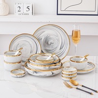 Service de table en porcelaine blanc veiné de marbre et bordé d'or, luxueux, résistant à la décoloration, idéal pour les mariages, les réceptions formelles et les cadeaux.