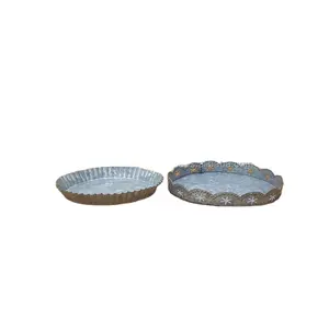 Modern round metal trays are used to decorate the living room and kitchen serving tray