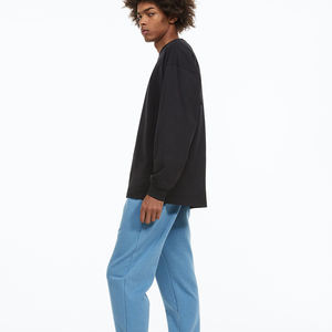 OEM personalizado negro pantalones de correr de gran tamaño para los hombres de moda de invierno de pista de sudor con cremallera hecha de lona - Product Image 5