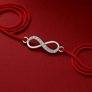 Juego de Rakhi de Plata Preciosa Zarkan Infinity Love con Roli Chawal, Joyería Cultural Coleccionable - Product Image 1