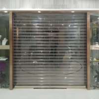 Volets roulants pliables en polycarbonate transparent sur mesure avec rails latéraux en acier inoxydable pour entrepôt et supermarché