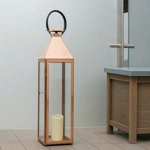 Lanterne en acier inoxydable conçue pour une décoration intérieure unique et un éclairage d'ambiance chaleureux au style moderne - Product Image 1