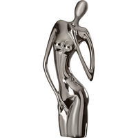 Sculpture artisanale moderne en métal au design féminin, en aluminium moulé nickelé noir, objet décoratif de table