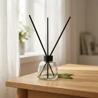 Bouteilles de diffuseur à roseaux rondes 100ml 200ml 300ml en verre scellées au liège sérigraphiées pour parfum d'ambiance