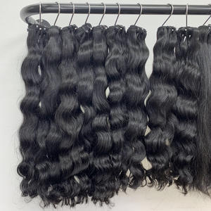 Venta al por mayor de extensiones de cabello humano Remy virgen 100% de alta calidad, ondulado, doble trama, cabello crudo de Vietnam, color 1B, sin químicos. - Product Image 1