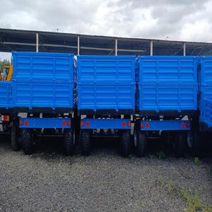 Mini semirremolque agrícola de 2 ruedas para tractor ambulante con motor y engranaje Entrega segura de alta productividad - Product Image 2