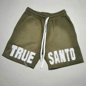 กางเกงขาสั้นผ้าฝ้าย100% สไตล์สตรีทสีทึบลำลองดีไซน์เอวขนาดกลางระบายอากาศได้ดีพิมพ์ลายสกรีนลายผ้าออกซ์ฟอร์ดแบบถัก - Product Image 2