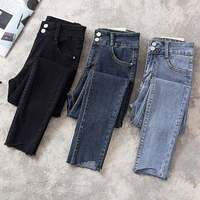 Jeans en denim déchiré décontracté pour femme, taille haute extensible, couleur unie, avec boutons clairs et rivets foncés, imperméable, vente en gros sur mesure