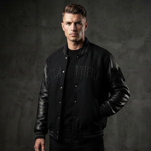 Chaqueta de hombre negra de lana con mangas de cuero y botones a presión, cuello y puños con ribetes, paneles en contraste, estilo casual y urbano, ajuste personalizado. - Product Image 3