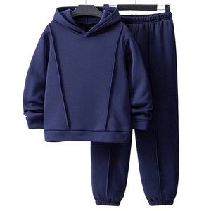 Ensemble de survêtements unisexes formels personnalisés pour enfants OEM avec logo en tissu athlétique respirant Options de personnalisation Marque de distributeur - Product Image 1