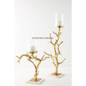 Vente en gros de bougeoirs de haute qualité en métal plaqué or et verre transparent fabriqués de façon unique et fantaisiste - Product Image 1