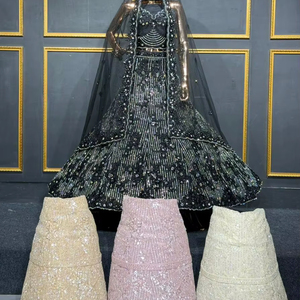 Lehenga choli de mariée entièrement brodé avec des détails en jarkan lourds et une grande traîne, conçu pour un style de mariée traditionnel - Product Image 1