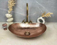 Lavabo ovale en cuivre martelé de design moderne pour comptoir de cuisine domestique, prix compétitif, disponible en plusieurs modèles de bassins et de cuves