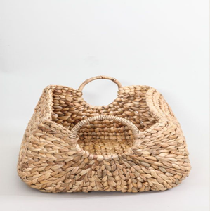 It's a structured <b>bag</b> with a wide, tapered body made from a tightly woven water hyacinth - Product Image 5