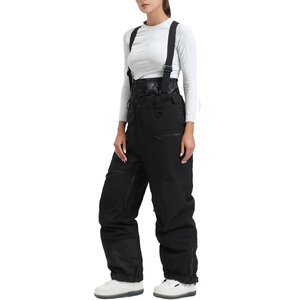 Baberos de esquí para mujer Pantalones de nieve con aislamiento impermeable personalizado OEM con material transpirable e impresión de logotipo para deportes de invierno - Product Image 1