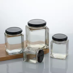 Frasco de vidrio hexagonal de diseñador con tapa Tapa de materiales personalizados de lujo Envase cosmético y tarro de dulces - Product Image 2