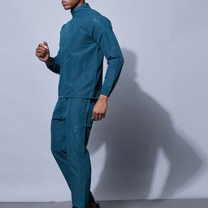 Survêtement athlétique bleu sarcelle pour homme, veste zippée à col montant avec motif géométrique sur les épaules et pantalon de jogging ajusté assorti, vêtements de sport - Product Image 2