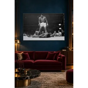 Impression sur toile Fida : Muhammad Ali noir et blanc debout au-dessus de son adversaire dans le ring - Product Image 1