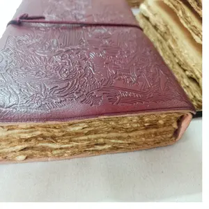 custom made old look handmade paper leather journals with deckle edged papers made in the book of the dead,celtic cross and key