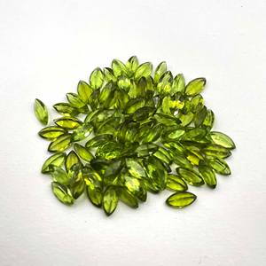 พลอยเพอริดอทดิบสีเขียวธรรมชาติ 100% รูปทรงมาร์คีส์ จำนวน 20 เม็ด ขนาด 5x10 มม. น้ำหนัก 20 กะรัต แบบตาแมว ขายส่ง - Product Image 1