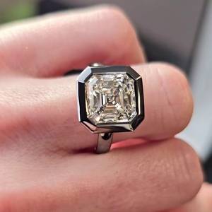 แหวนหมั้นเพชรทรง Asscher ขนาด 5.10 กะรัต เพาะเลี้ยงในห้องปฏิบัติการ ประดับขอบเพชรแบบ Pav Halo ได้รับการรับรองจาก IGI - Product Image 1