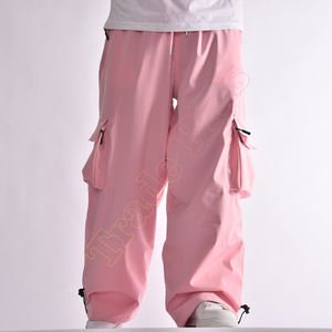 Pantalones de esquí impermeables de color rosa claro al por mayor para Uniesx con cintura ajustable y bolsillos cargo con cremallera pantalones holgados de esquí - Product Image 1