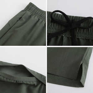 Pantalones cortos deportivos personalizados para hombres, pantalones cortos de gimnasio transpirables de secado rápido OEM con bolsillos para correr, entrenamiento o ropa deportiva - Product Image 3