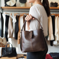 Nouveautés 2025 – Sac seau de luxe en cuir véritable avec fermeture éclair géométrique et chaînes, style bohème minimaliste pour femme, avec bandoulière