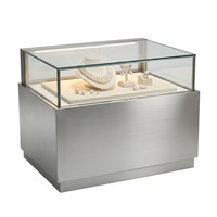 Vitrine de présentation haut de gamme en acier inoxydable sur mesure pour salle d'exposition, magasin de détail, présentoir à bijoux