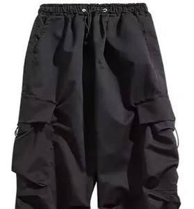 Pantalon cargo ample unisexe avec cordon de serrage réglable à la taille et à l'ourlet, design multi-poches pour streetwear et usage extérieur - Product Image 1