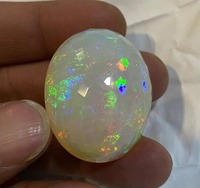 Opale naturelle multi-éclats taille ovale 35,54 carats, traitement par cirage/huile, changement de couleur, certifiée par un tiers