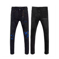 Jeans skinny délavés pour hommes avec patchwork et éclaboussures de peinture Pantalon en denim perlé extensible de qualité supérieure pour garçons
