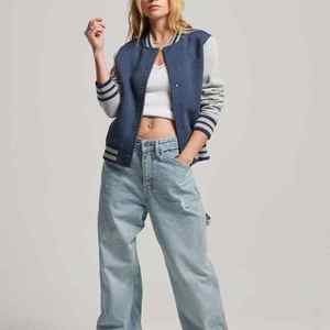 Women Varsity <b>Jacket</b> - High-Quality Material, Ribbed Hemline, and Snap Button Closure - Product Image 4