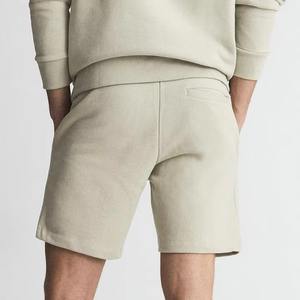 กางเกงขาสั้นผ้าฝ้าย100% สีทึบสำหรับผู้ชายกางเกงขาสั้นของผู้ชายแบบผูกเชือกแบบลำลองระบายอากาศได้แห้งเร็วไม่เหมือนใครโลโก้ตามสั่ง - Product Image 2