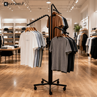 Portants à vêtements mobiles en métal chromé rotatifs, unités d'affichage de vêtements personnalisables pour boutiques de détail