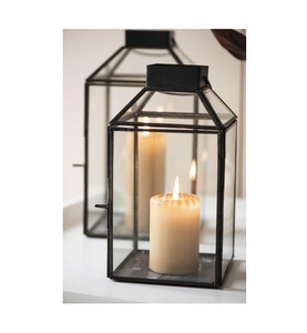 Juego de 2 velas decorativas de metal y vidrio en borde negro acabado para decoración interior y exterior - Product Image 1